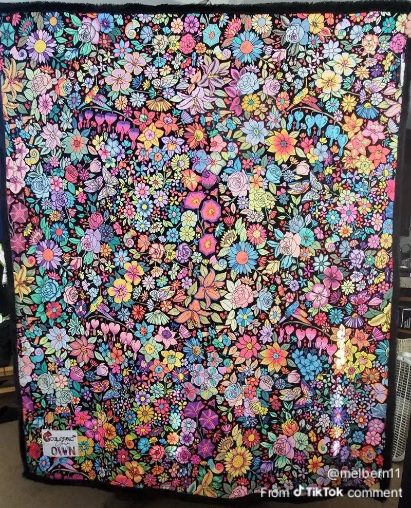 A fully colored Coloring Your Own floral blanket