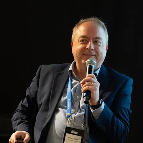 An attendee asking a question from the floor at IPx LA
