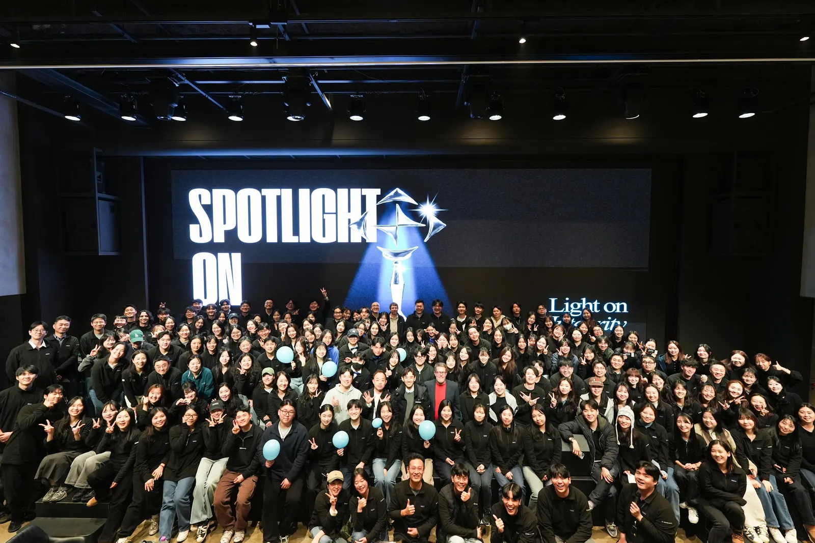 The whole MarqVision Korea team in the auditorium at Spotlight on MarqVision