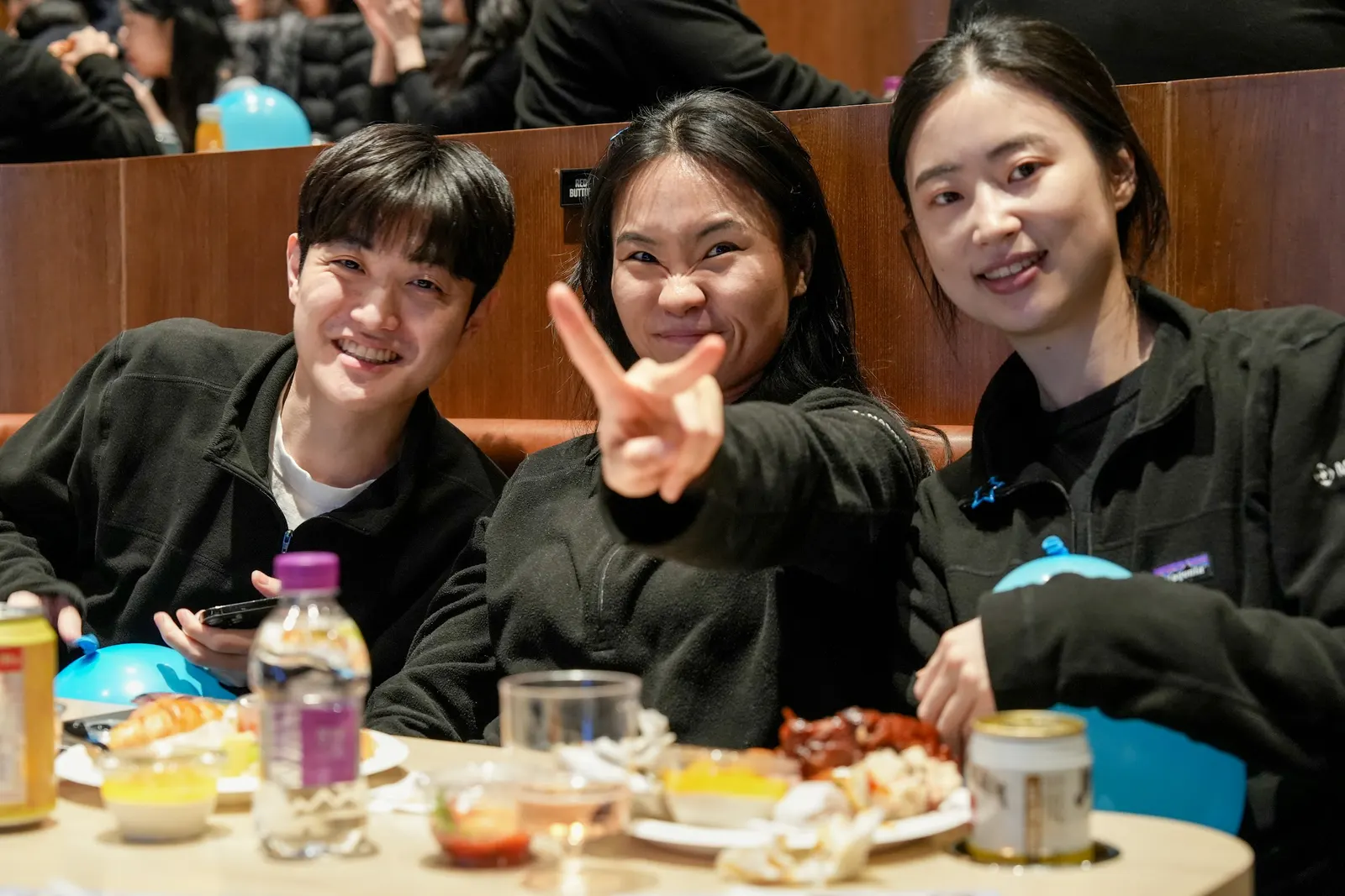 Three colleagues laughing together